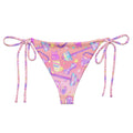 Glitter Gains String Bikini Bottom features a vibrant print and adjustable ties, perfect for poolside relaxation this summer.