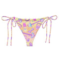 Glitter Gains String Bikini Bottom features a fun print, perfect for sunbathing by the pool this summer.
