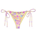 Bright and playful Glitter Gains String Bikini Bottom, perfect for sunbathing by the pool with adjustable straps.