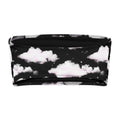Cloudy Sky bandeau bikini top with black background and white fluffy clouds, perfect for tanning and lounging.