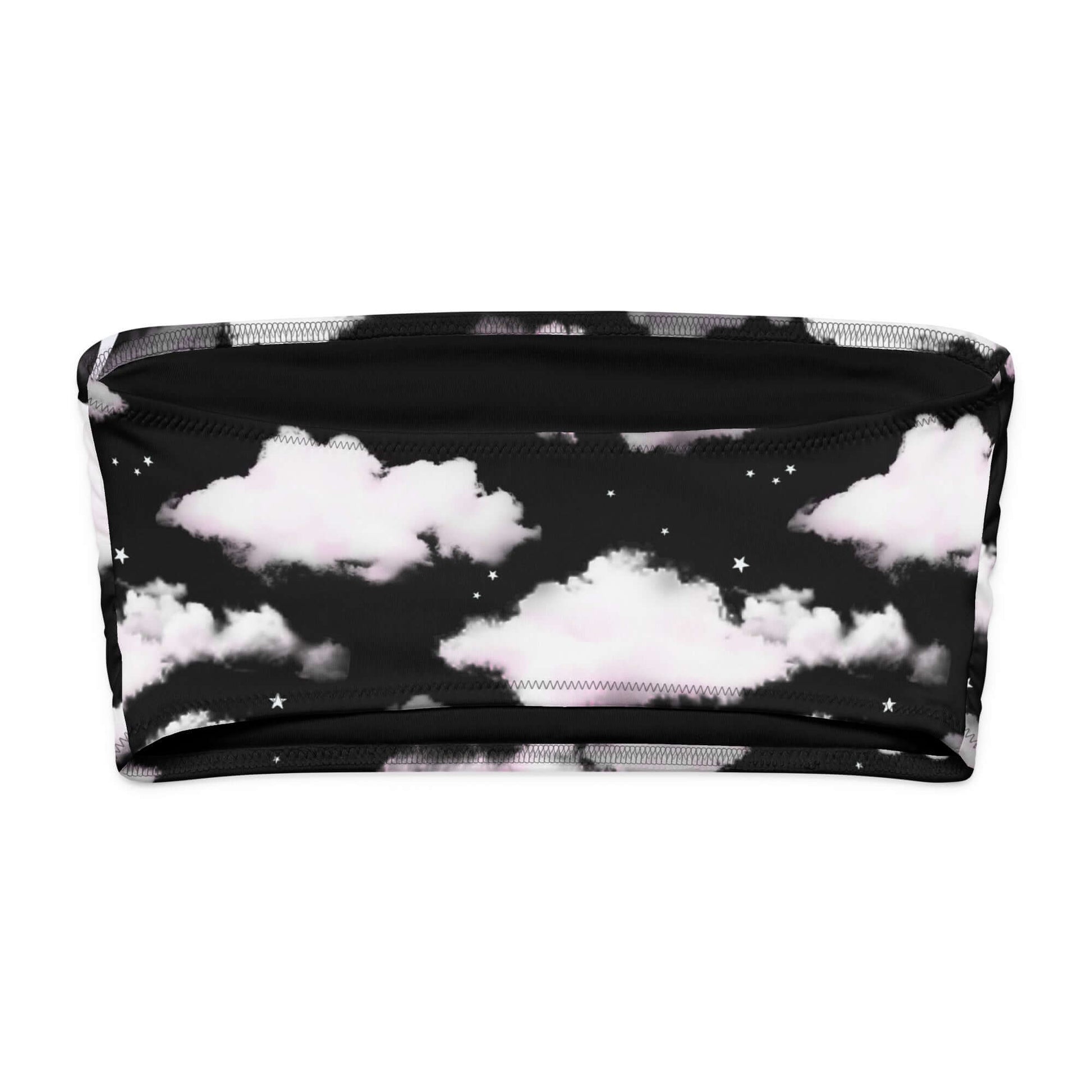 Cloudy Sky bandeau bikini top with black background and white fluffy clouds, perfect for tanning and lounging.