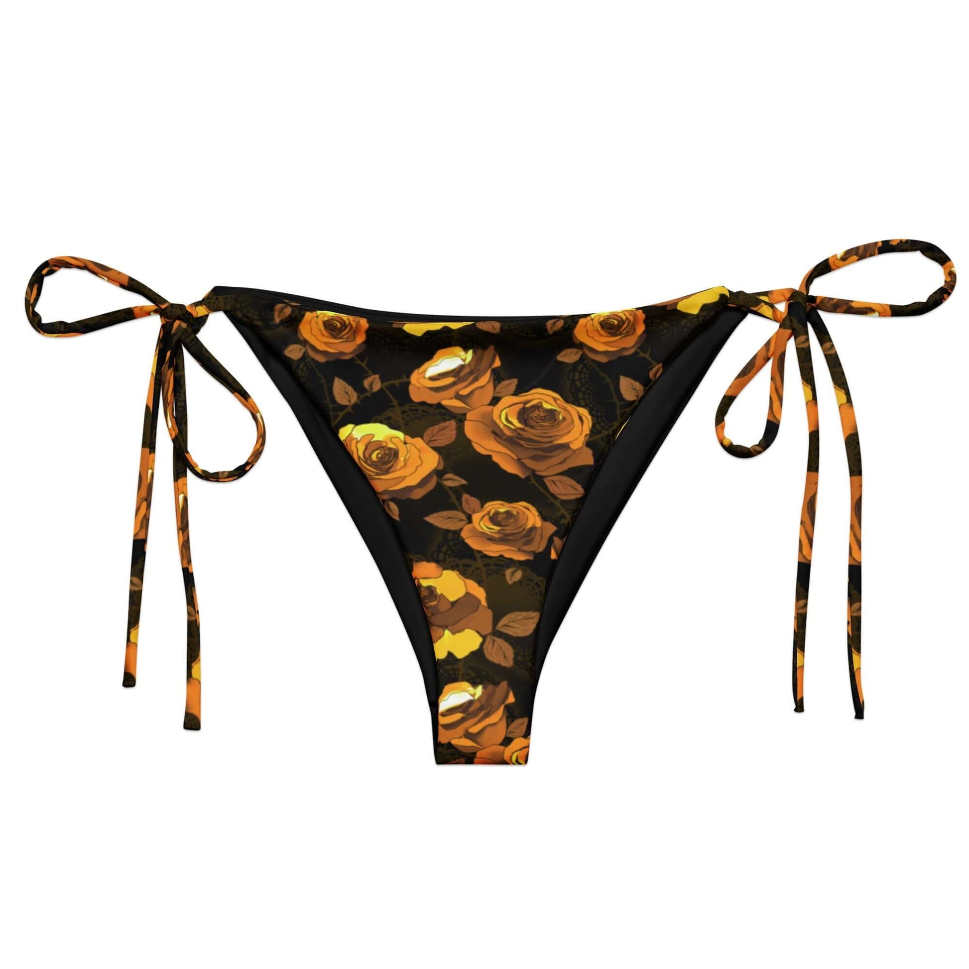 Soft and stylish Enchanted Rose String Bikini Bottom with adjustable straps, perfect for sunbathing by the pool.