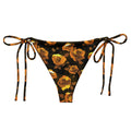 Enchanted Rose String Bikini Bottom features a floral design, perfect for sunbathing by the pool in style.