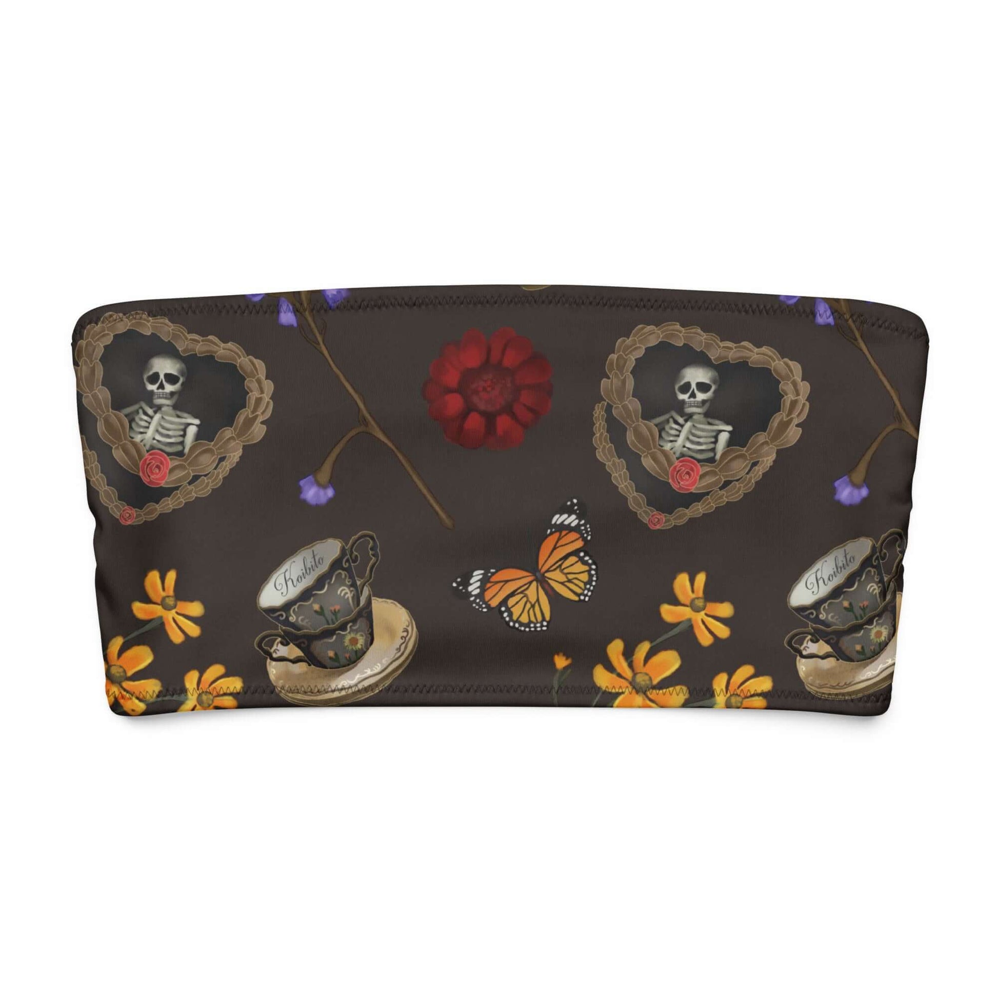 Gothic Tea Time bandeau bikini top with whimsical skeletons, butterflies, and floral designs on a dark background.