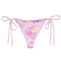 Indica Magica String Bikini Bottom featuring playful designs, perfect for sunny days by the poolside.