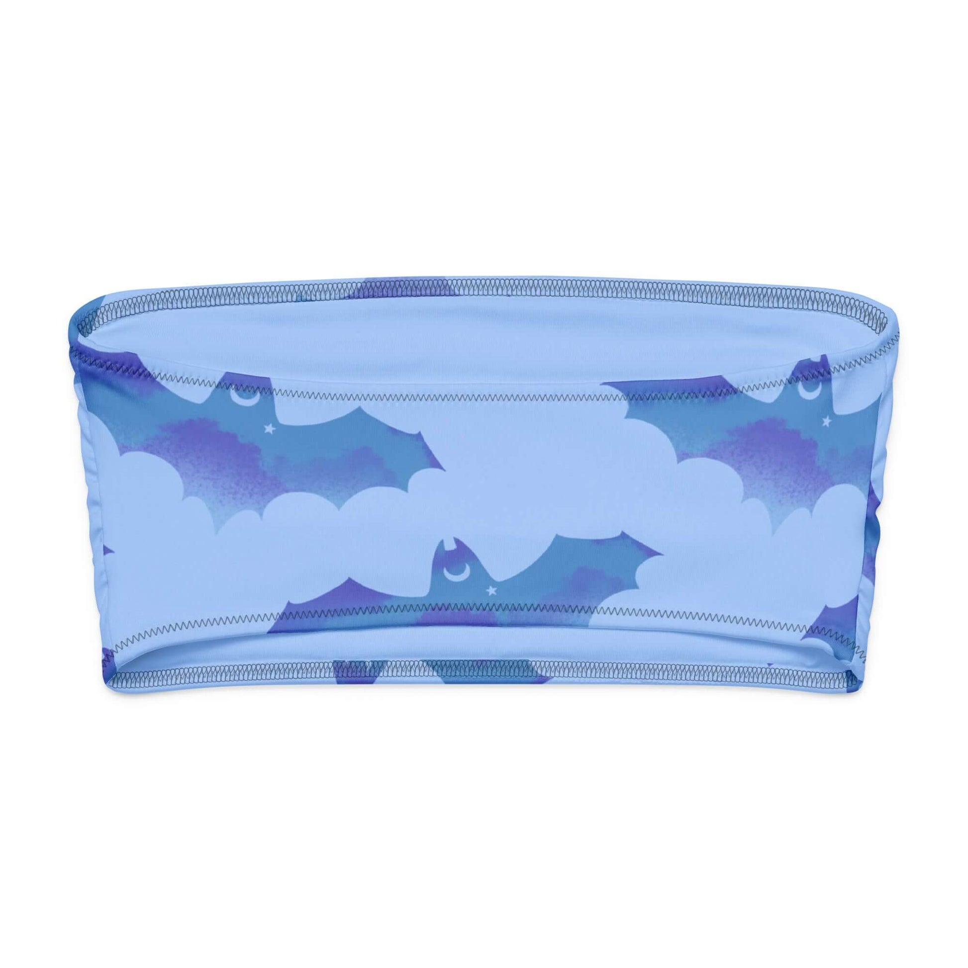 Lilith Bandeau Bikini Top in blue with bat and cloud design, perfect for tanning and lounging.