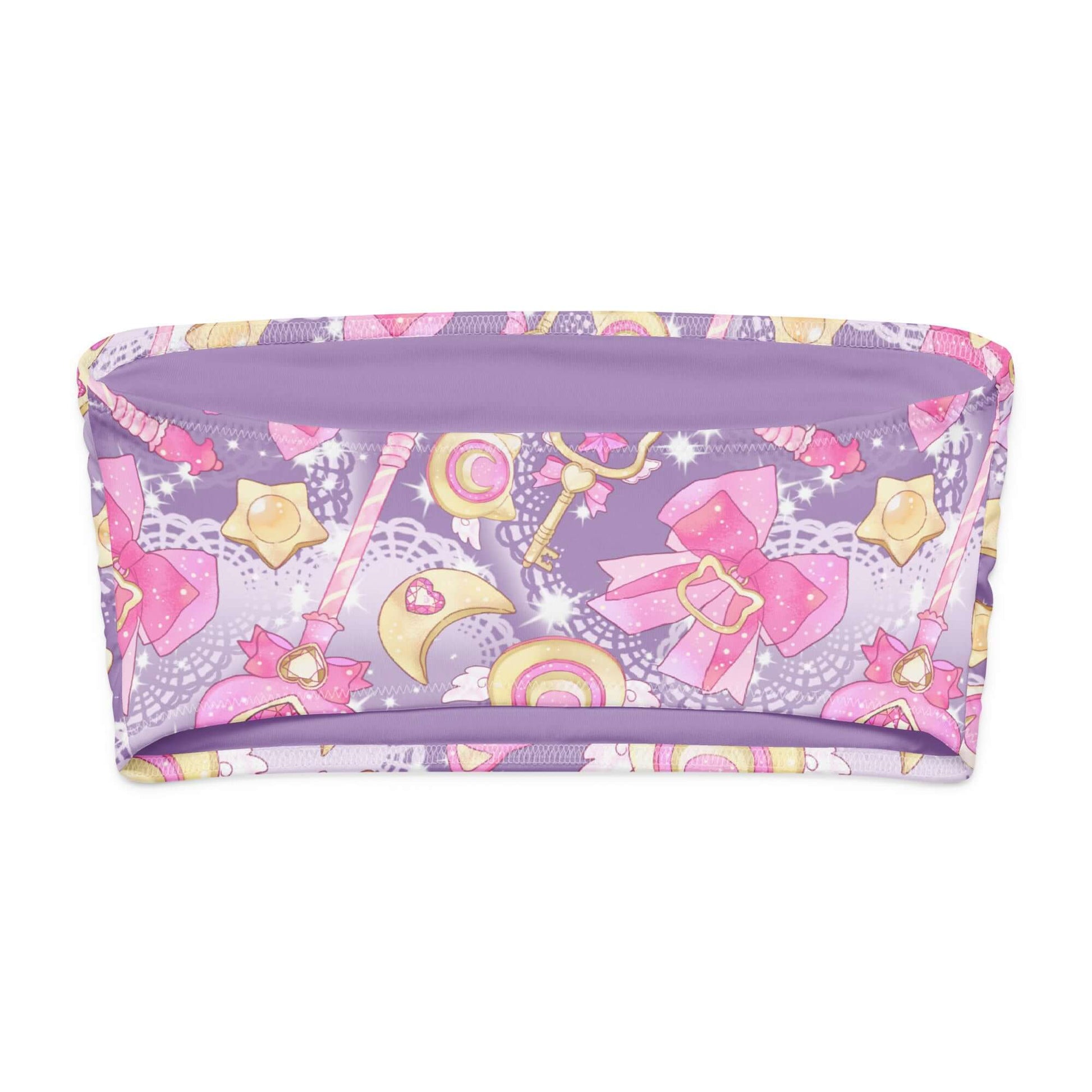 Magical Girl bandeau bikini top in purple with whimsical patterns of bows, stars, and wands.