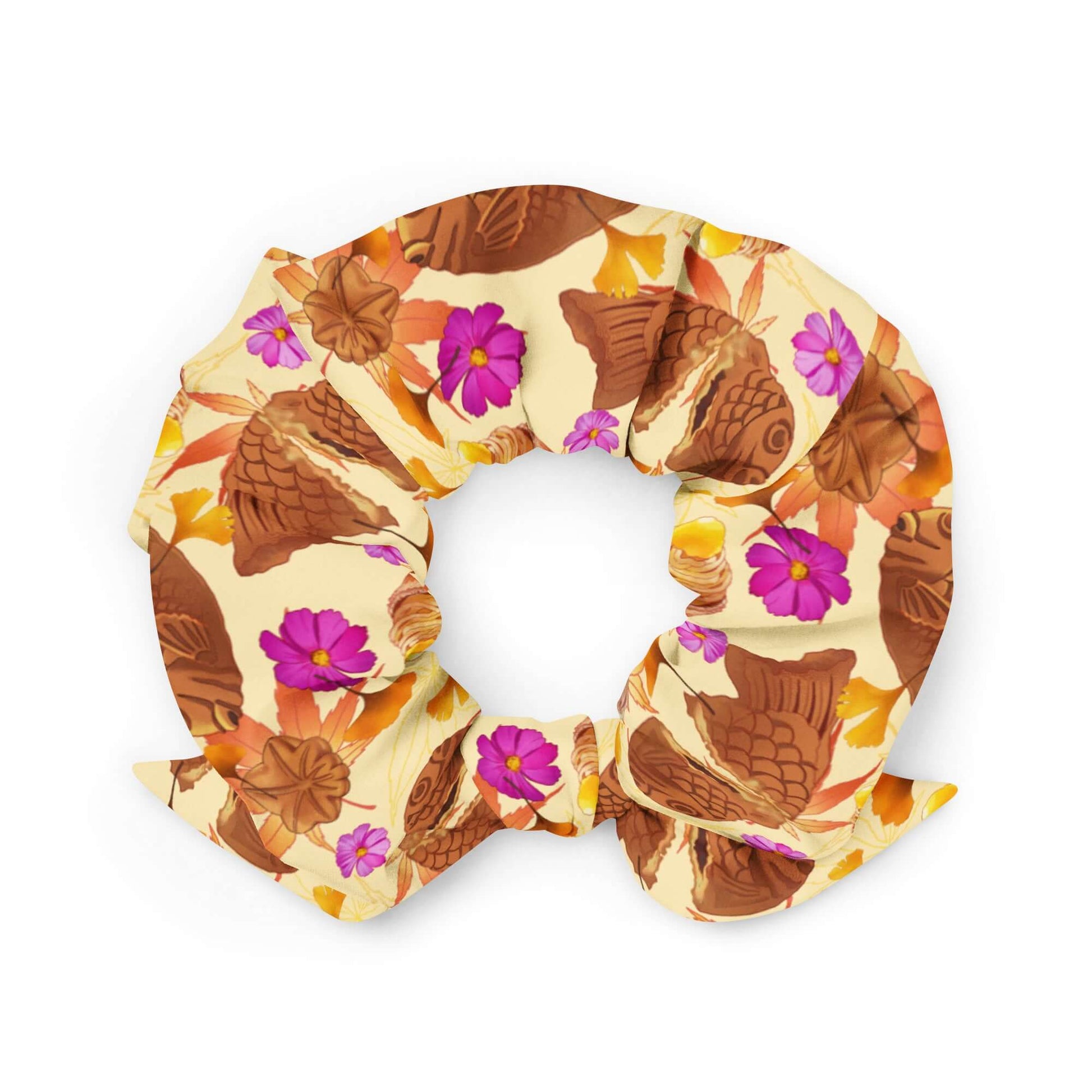 Stylish Momiji Scrunchie featuring vibrant leaves and treats, perfect for adding flair to your outfit.