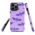 Stylish Morrigan iPhone® Tough Case features bats on purple, offering durable protection for your device year-round.