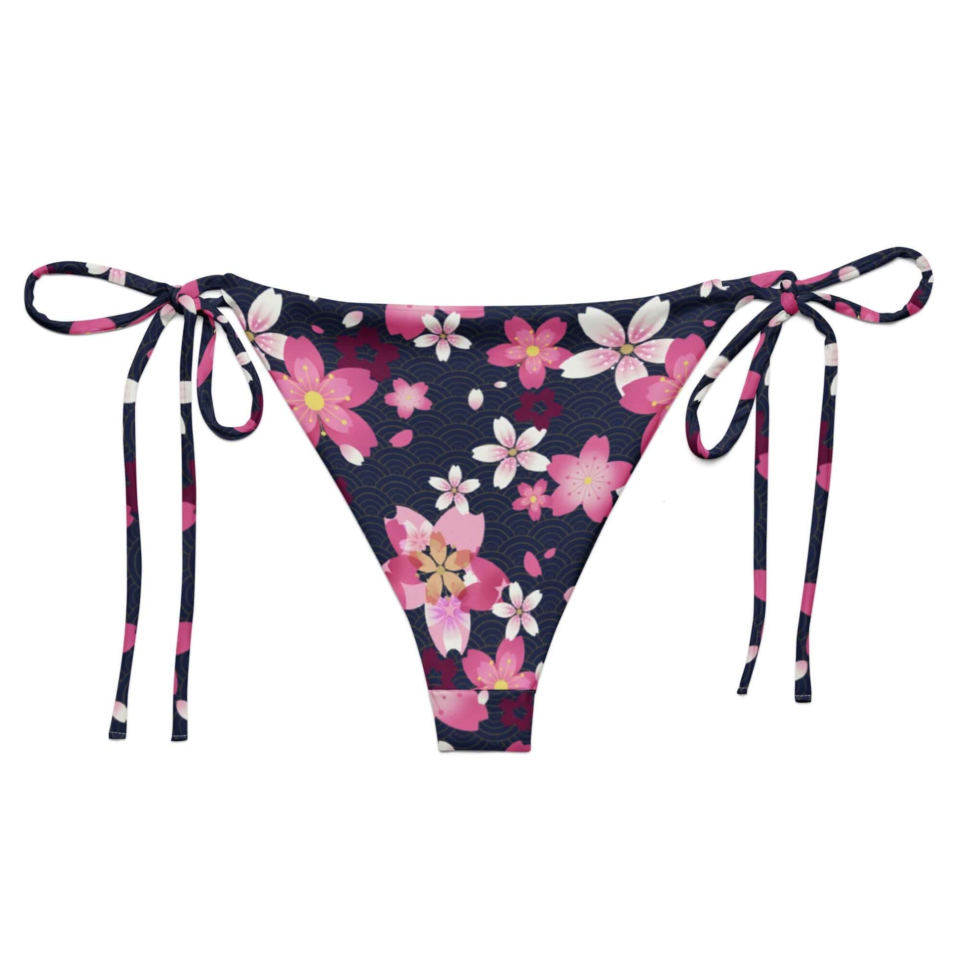 Sakura String Bikini Bottom features a floral design, perfect for sunbathing by the pool this summer.