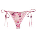 Sakura String Bikini Bottom features a floral design, perfect for sunbathing by the pool this summer.