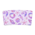 Pastel sea-themed bandeau bikini top with shells and starfish design on a light purple background.