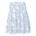 Flattering Snow Puppy Skater Skirt features adorable puppies on a pastel blue background, perfect for any outfit.