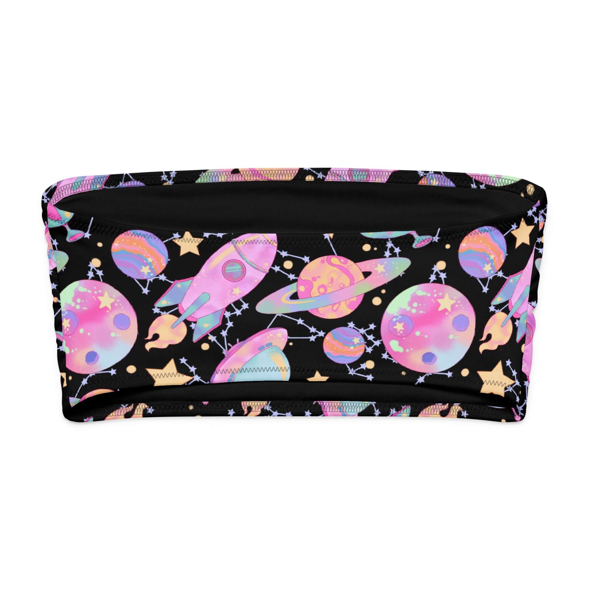 Colorful space-themed bandeau bikini top with planets, rockets, and stars on a black background.