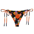 Bright and vibrant Sugar Skull String Bikini Bottom, perfect for summer poolside lounging with adjustable ties.