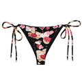 Sugar Sweetheart String Bikini Bottom features vibrant prints and adjustable straps, perfect for poolside relaxation.