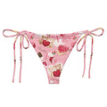 Sugar Sweetheart String Bikini Bottom features a playful design perfect for sunbathing by the pool this summer.