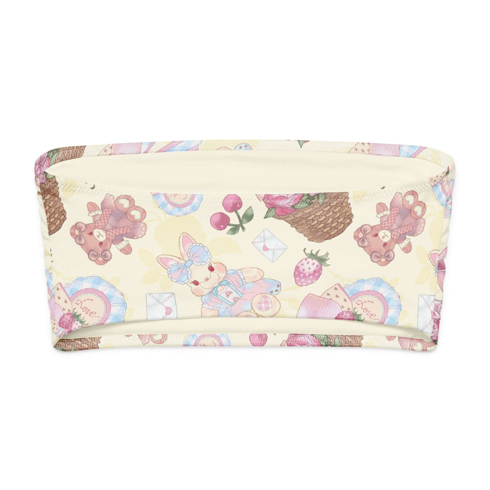 Soft bandeau bikini top with cute teddy bear and pastel fruit pattern, perfect for summer lounging.