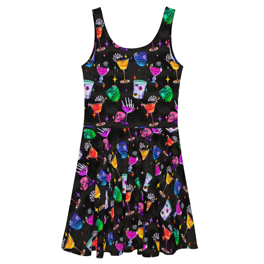 Stylish Monster Party Skater Dress features fun, colorful prints and a flared skirt, perfect for any spooky occasion.