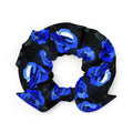 Stylish Enchanted Rose Scrunchie featuring vibrant blue roses, perfect for enhancing your daily wardrobe.
