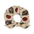 Gothic Tea Time Scrunchie featuring dark floral designs, perfect for adding a unique touch to your style.