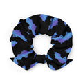 Stylish Lilith Scrunchie featuring a unique bat design, perfect for gym or night out outfits.