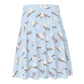 Snow Bird Skater Skirt features a playful print on a soft pastel background, perfect for winter outfits.