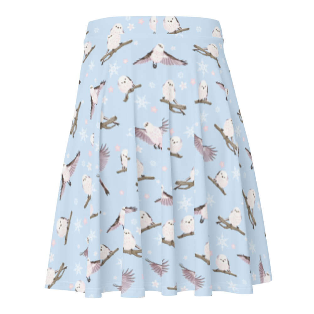 Snow Bird Skater Skirt features a playful print on a soft pastel background, perfect for winter outfits.