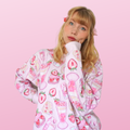 Pastel pink Strawberry Sweatshirt featuring cute fruit prints, perfect for achieving a kawaii aesthetic.