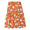 Bright orange Trick or Treaters Skater Skirt features playful pets and candy designs, perfect for Halloween fun!