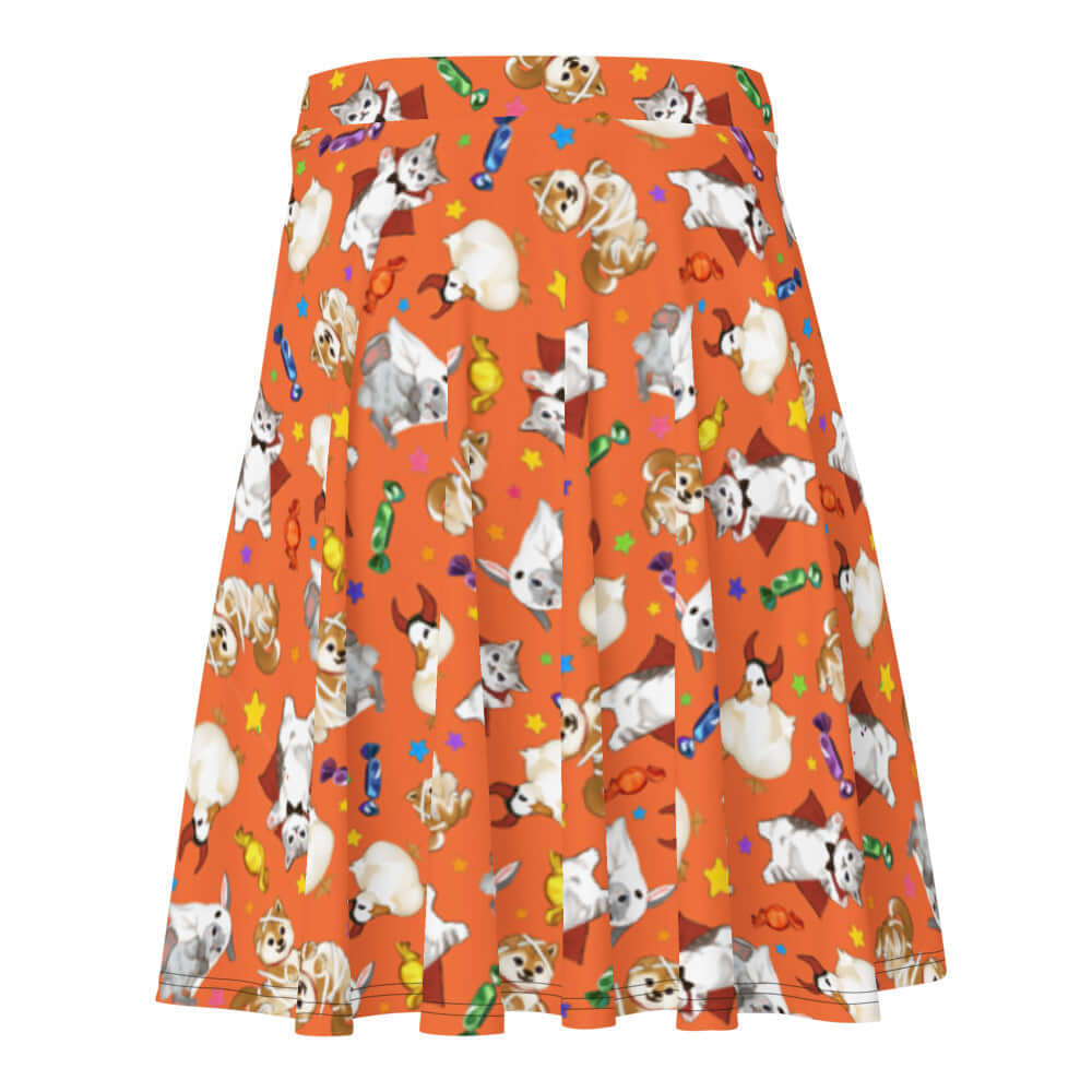 Bright orange Trick or Treaters Skater Skirt features playful pets and candy designs, perfect for Halloween fun!