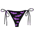 Relax by the pool in the Aensland String Bikini Bottom, featuring adjustable ties and soft recycled polyester.