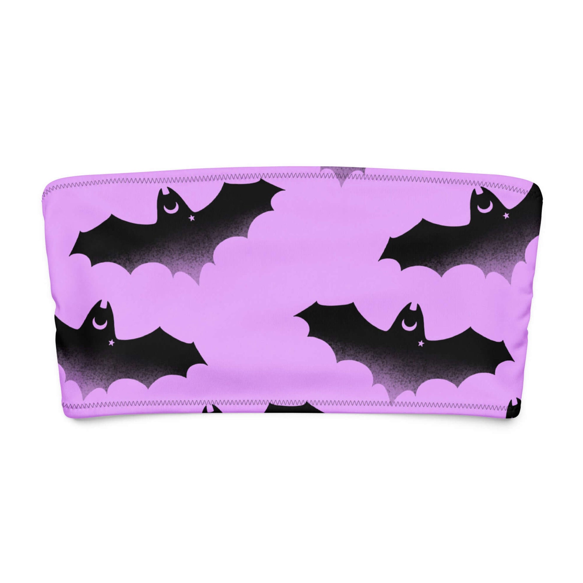 Aensland bandeau bikini top in pink with black bat and cloud pattern, perfect for stylish tanning or lounging.
