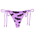 Aensland String Bikini Bottom in pastel purple with bat print, perfect for sunny days by the poolside.