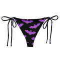 Aensland String Bikini Bottom featuring a playful bat print, perfect for poolside relaxation this summer.