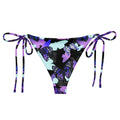 Stylish Butterfly String Bikini Bottom featuring vibrant butterfly prints, perfect for sunbathing by the pool.