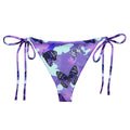 Elevate your summer style with the Butterfly String Bikini Bottom, perfect for poolside relaxation and sunbathing.