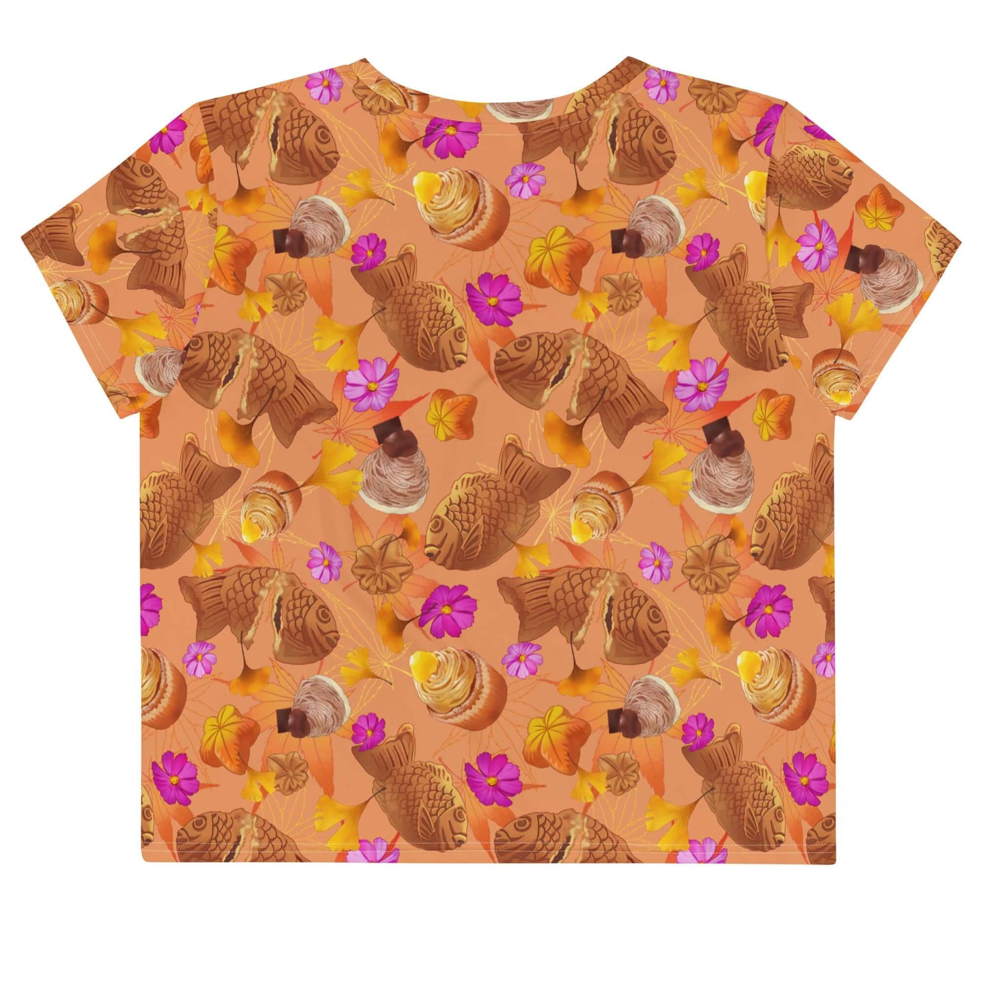 The Momiji Crop Top showcases a vibrant pattern with warm autumn colors and floral accents, perfect for fall styling.
