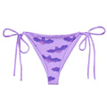 Morrigan String Bikini Bottom in purple with bat print, perfect for summer sunbathing and poolside relaxation.