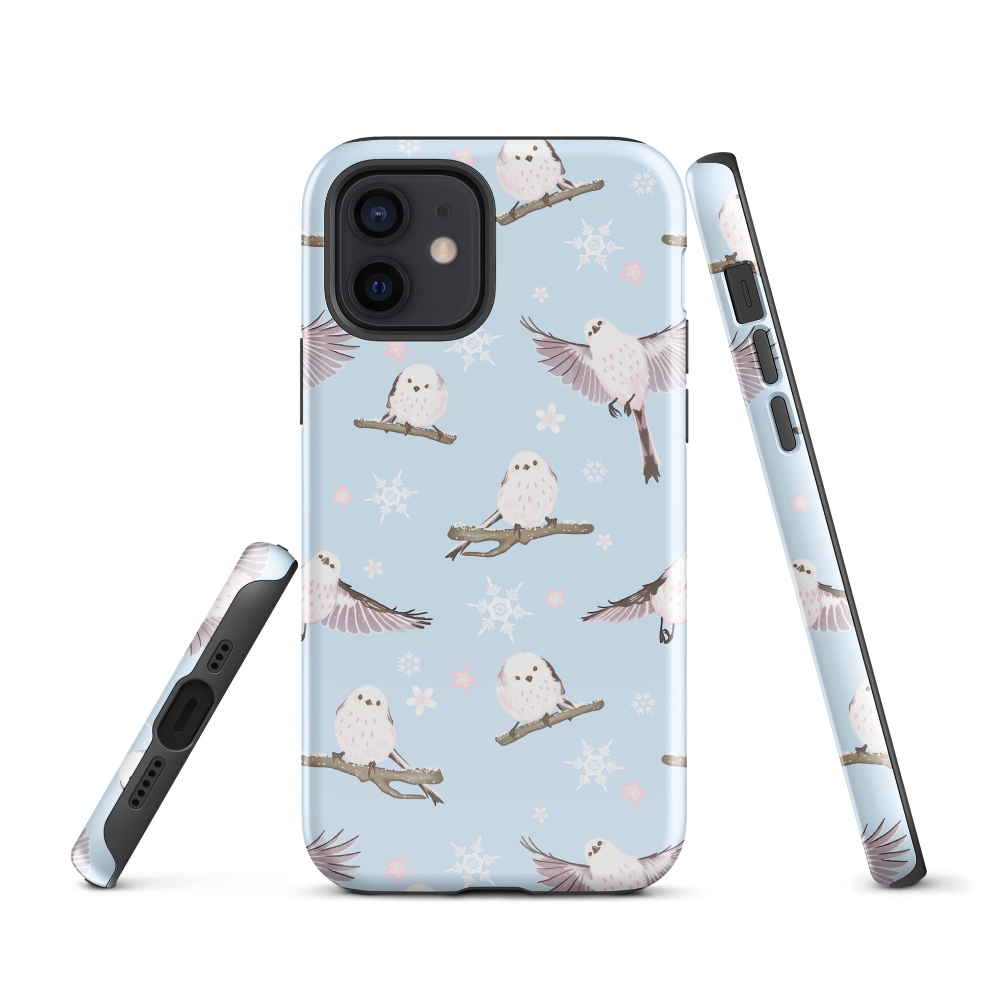 Snow Bird iPhone® Tough Case features a whimsical design with owls and snowflakes, ensuring style and protection year-round.