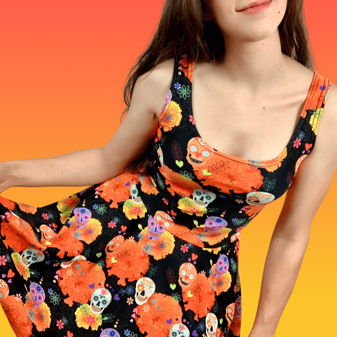 Vibrant Sugar Skull Skater Dress featuring fun patterns and a flared skirt, perfect for sunny days.