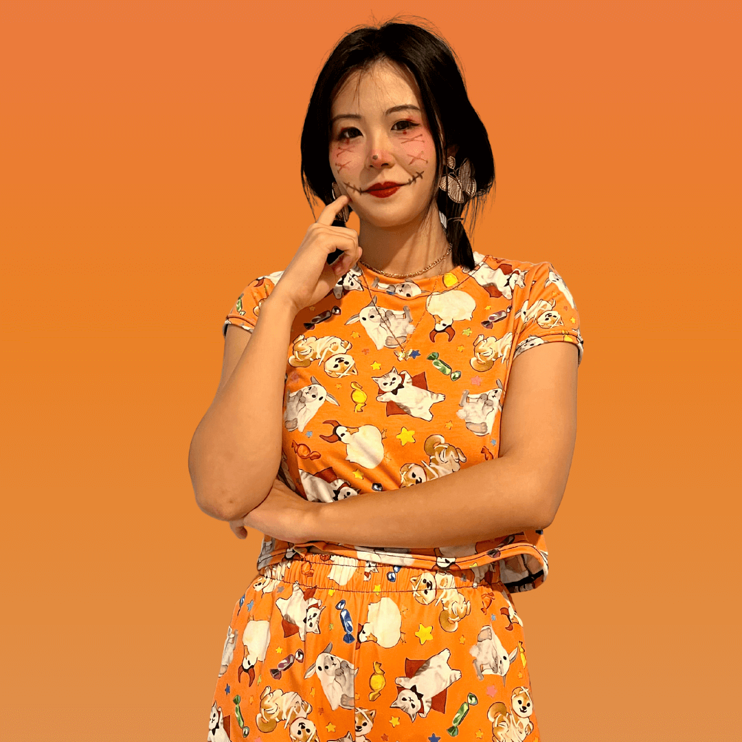 Stylish Trick or Treaters Crop Top perfect for Halloween fun and year-round wear, featuring a vibrant orange design.