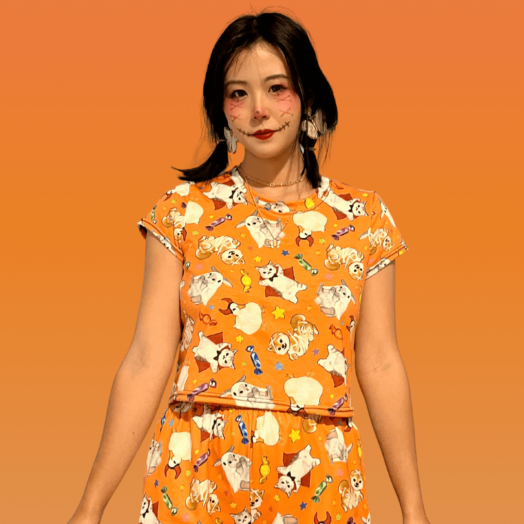 Celebrate Halloween year-round in the Trick or Treaters Crop Top, perfect for festive fun and candy shopping!