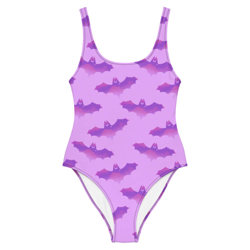 Flatter your figure in the Aensland One-Piece Swimsuit featuring a fun bat design for a unique beach look.