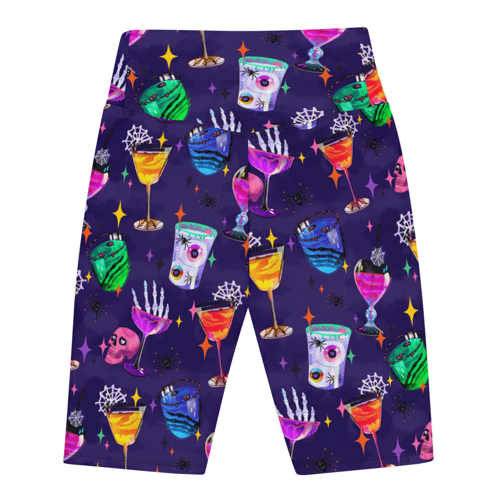 High-waisted Monster Party Biker Shorts feature a fun print of colorful drinks and spooky designs, perfect for workouts.