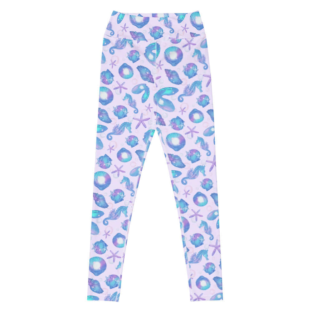 High-waisted Sea Princess Leggings feature a vibrant seashell and starfish print, perfect for a mermaid-inspired look.