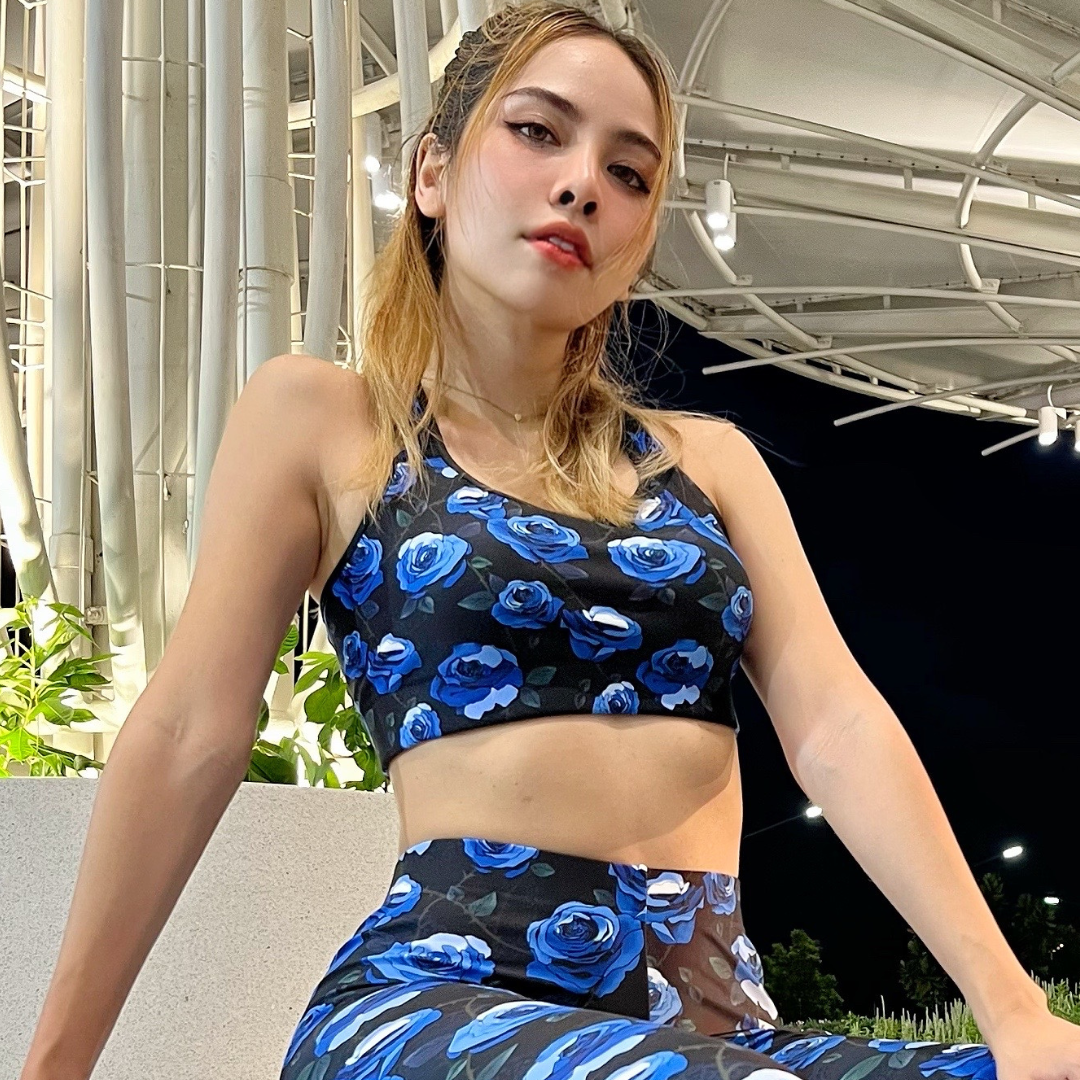 Stay stylish during workouts with the Enchanted Rose Sports Bra, featuring a striking floral design and moisture-wicking fabric.