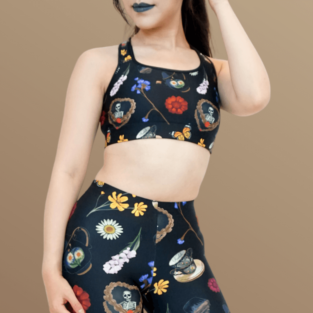 Gothic Tea Time Sports bra features whimsical floral and butterfly designs, perfect for adding personality to workouts.