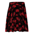 Flatter your figure with the Higanbana Skater Skirt, featuring bold red floral patterns on a dark background.