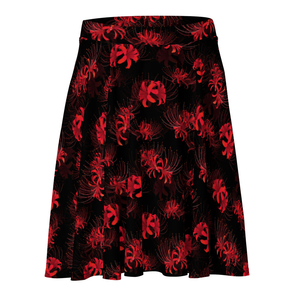 Flatter your figure with the Higanbana Skater Skirt, featuring bold red floral patterns on a dark background.